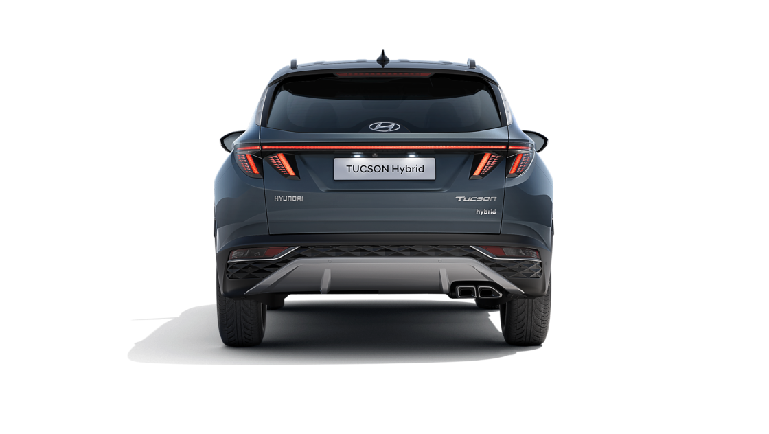 The All-New Hyundai Tucson Hybrid compact SUV pictured from the rear with its wide LED tail lamps.