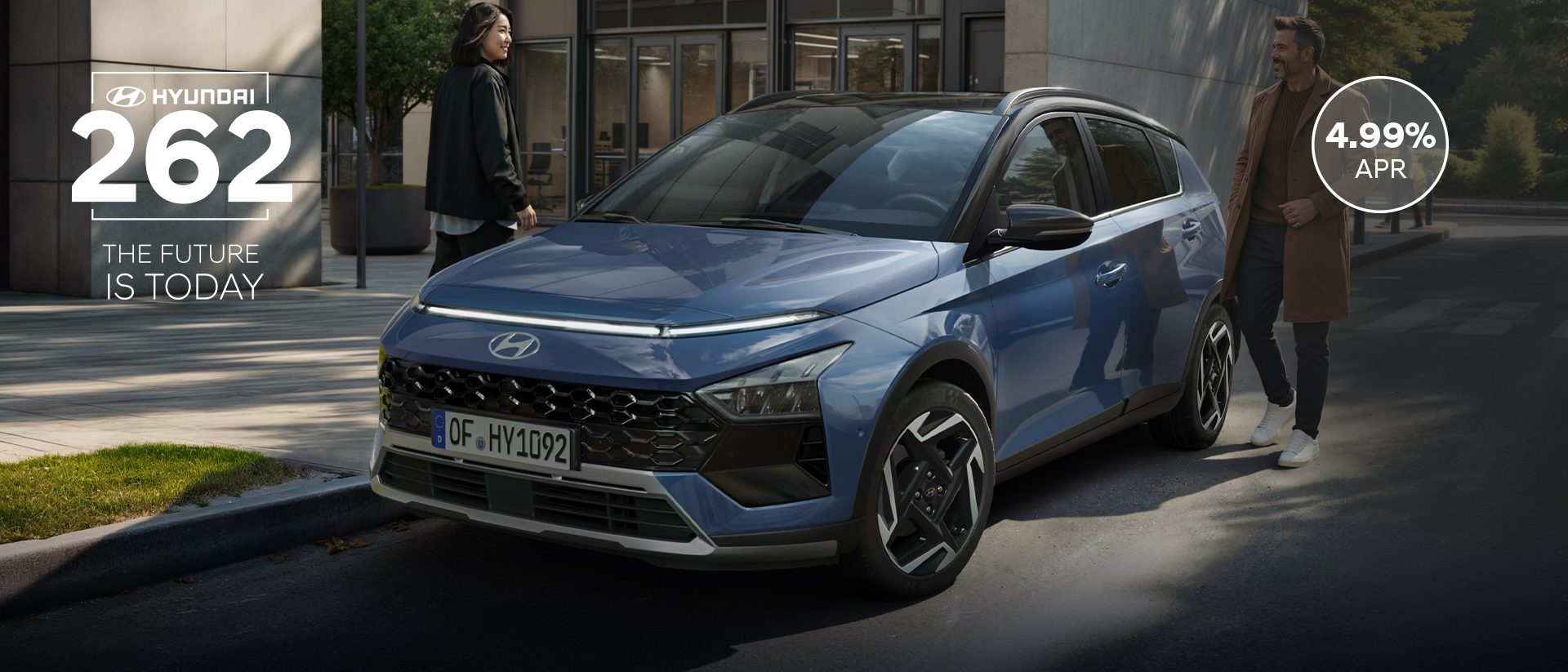 The new Hyundai BAYON is seen the front, with urban housing in the background.