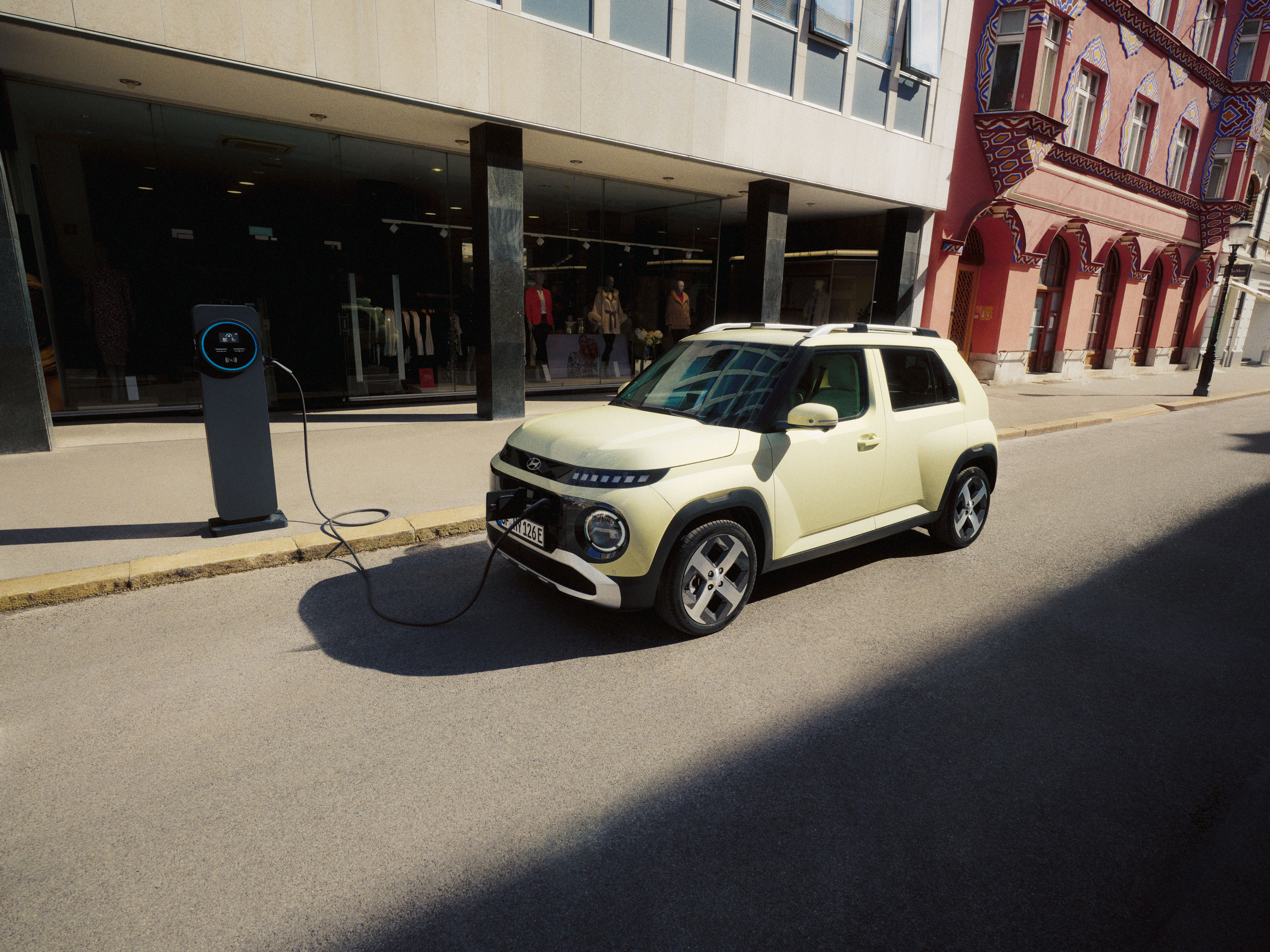 INSTER is charging up in front of a clothing store.