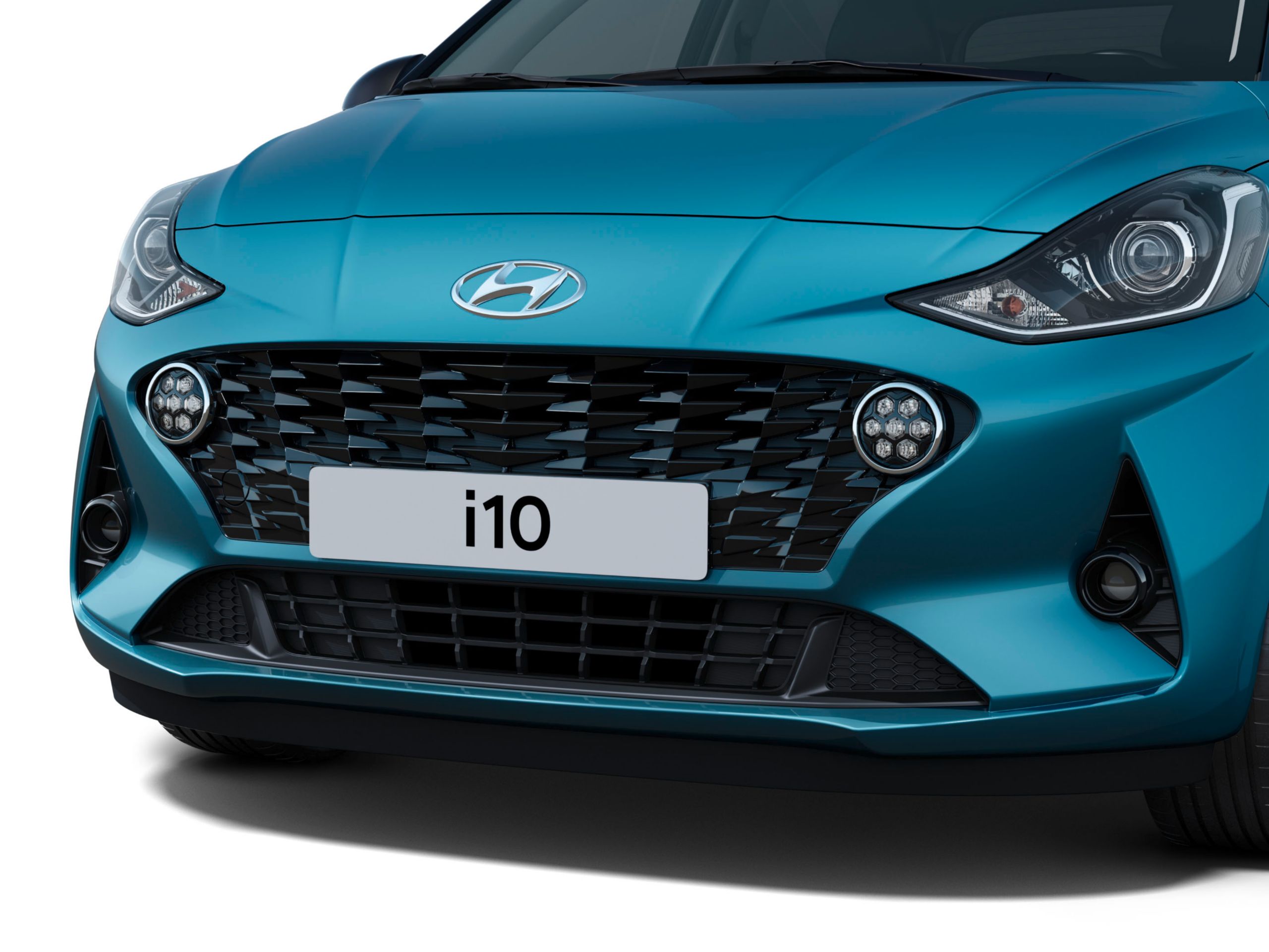 The Hyundai i10 in Aqua Turquoise Metallic from the front with its new bold grille.