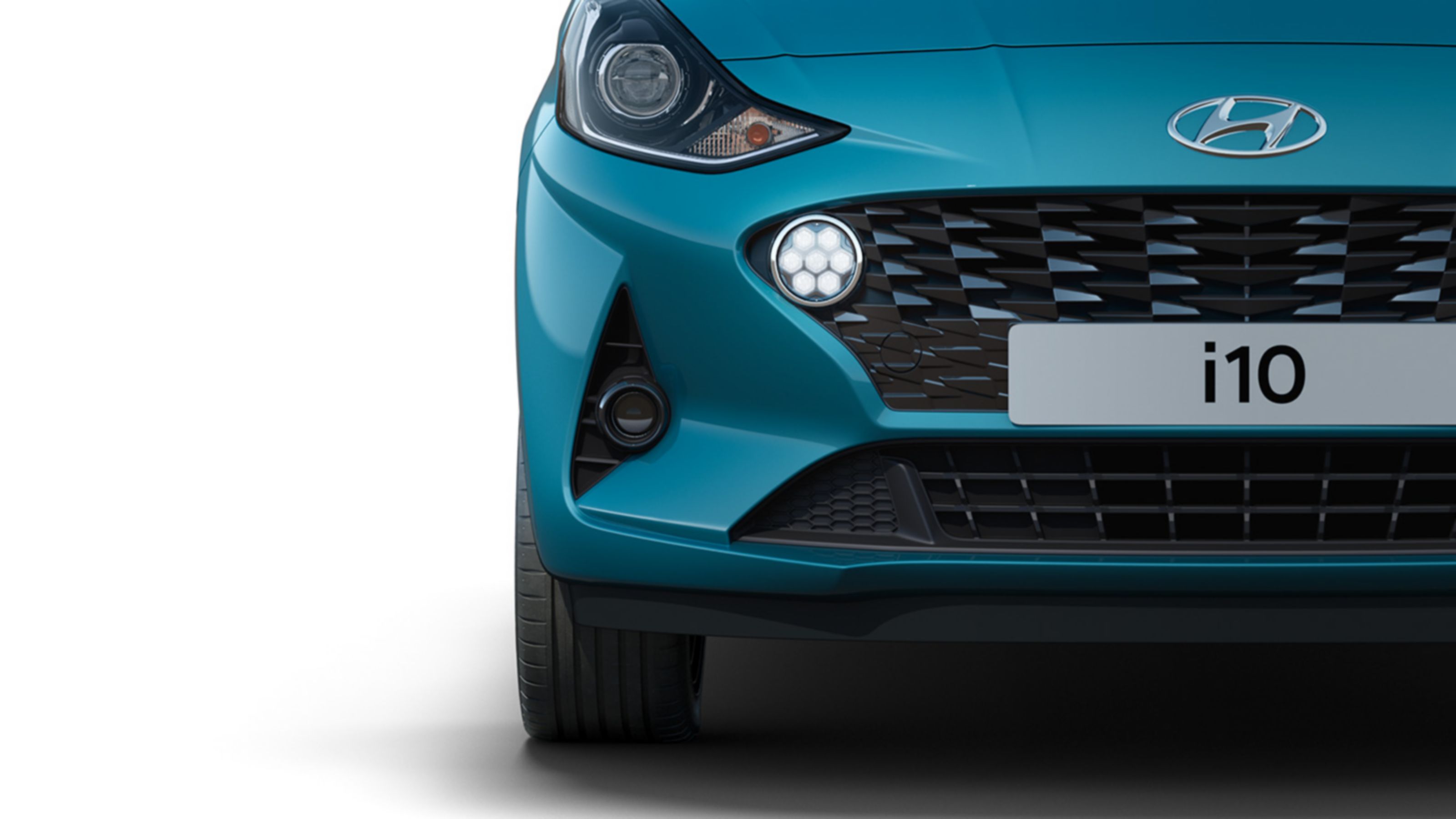 A close up look at the Hyundai i10's Bi-function projection headlamps and LED Daytime Running Lights.  