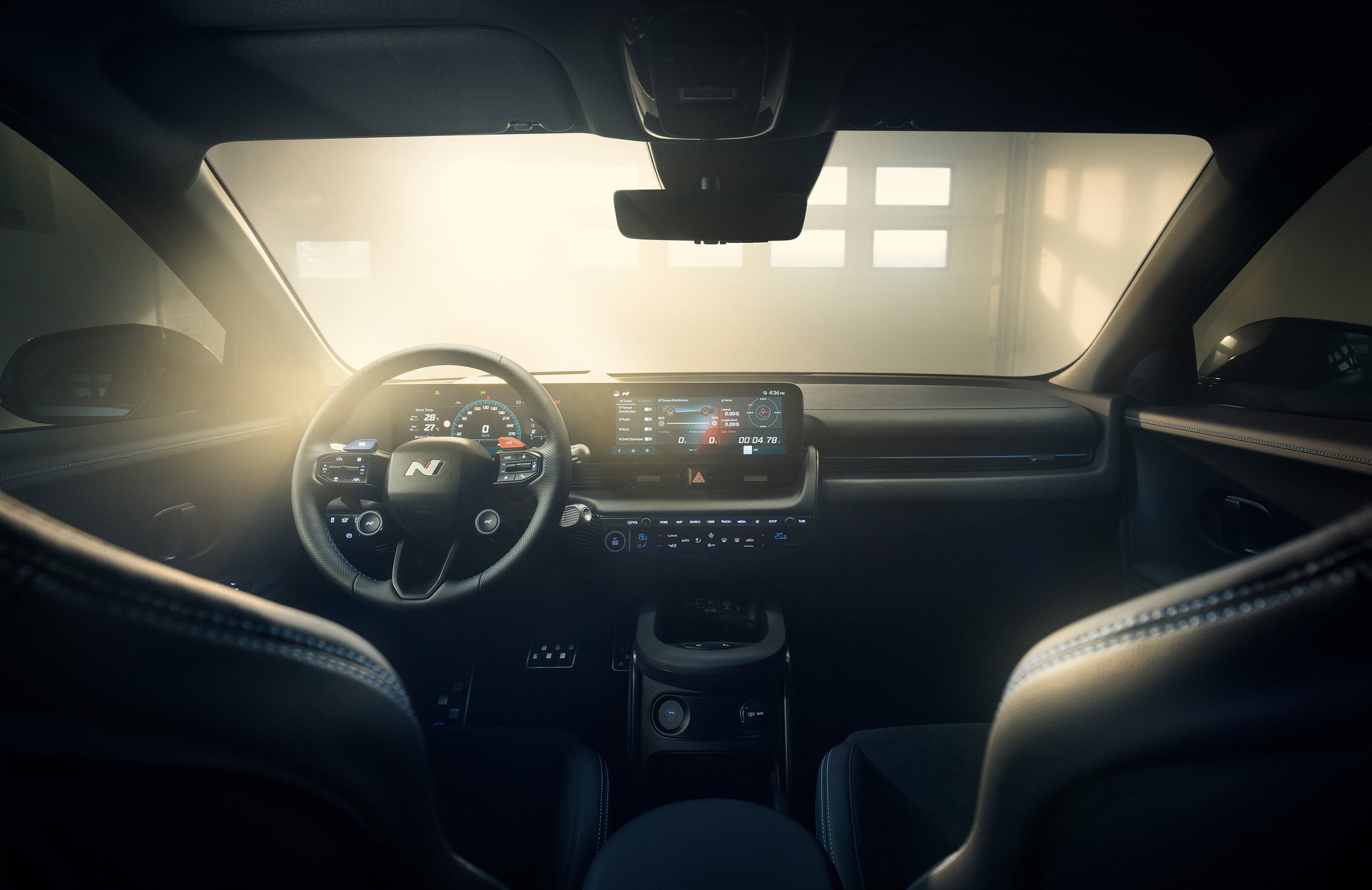 Inside view of the Hyundai IONIQ 5 N and its driving wheel and boarding panel. 