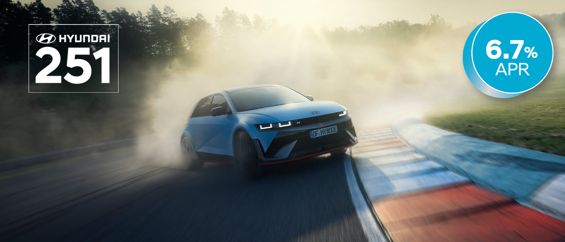 The all-electric Hyundai IONIQ 5 N drifting through a curve on a racetrack with smoking tyres.