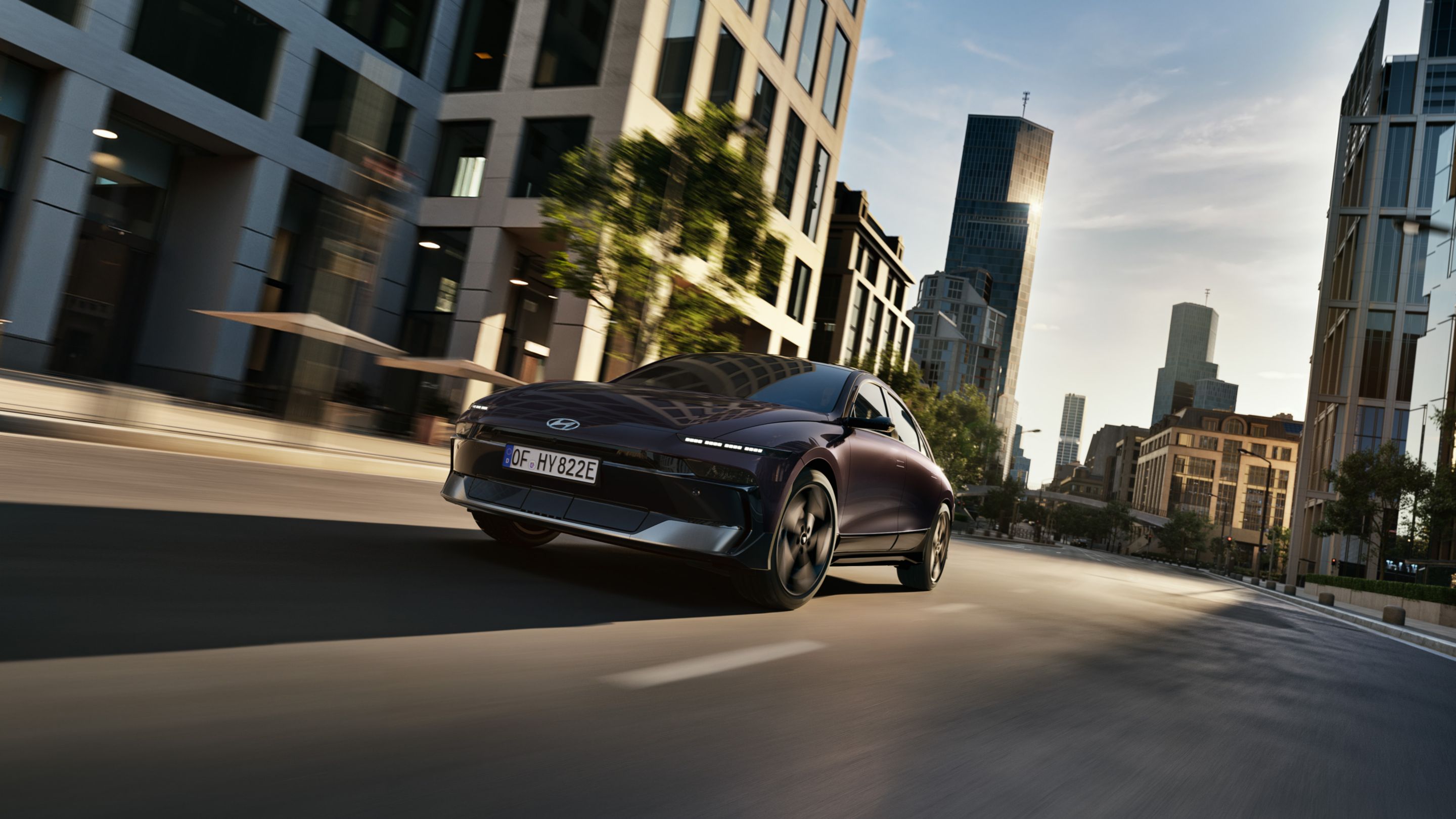 Hyundai IONIQ 6 driving on a city street.