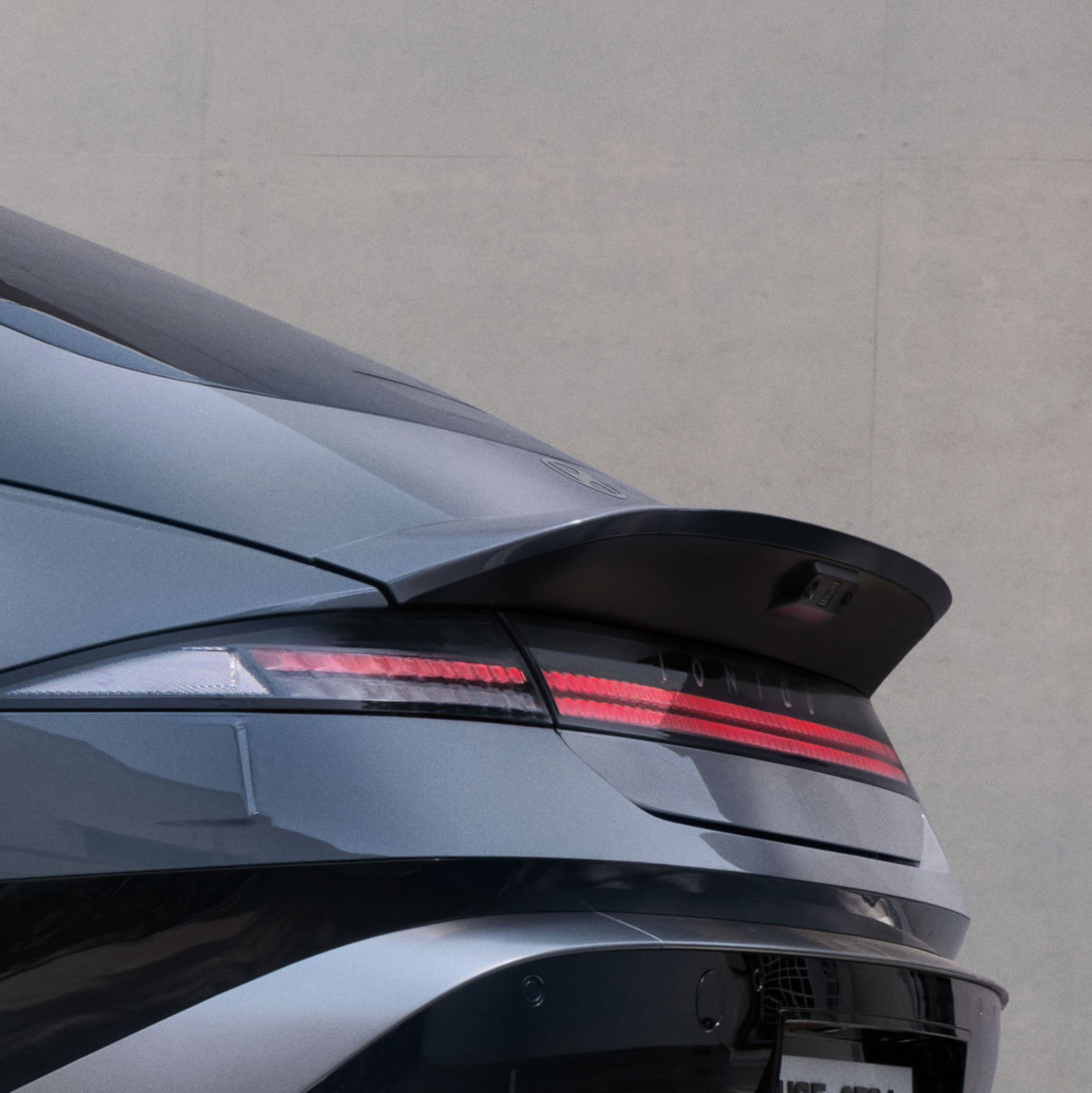 Hyundai IONIQ 6 rear view showing integrated spoiler and horizontal light bar