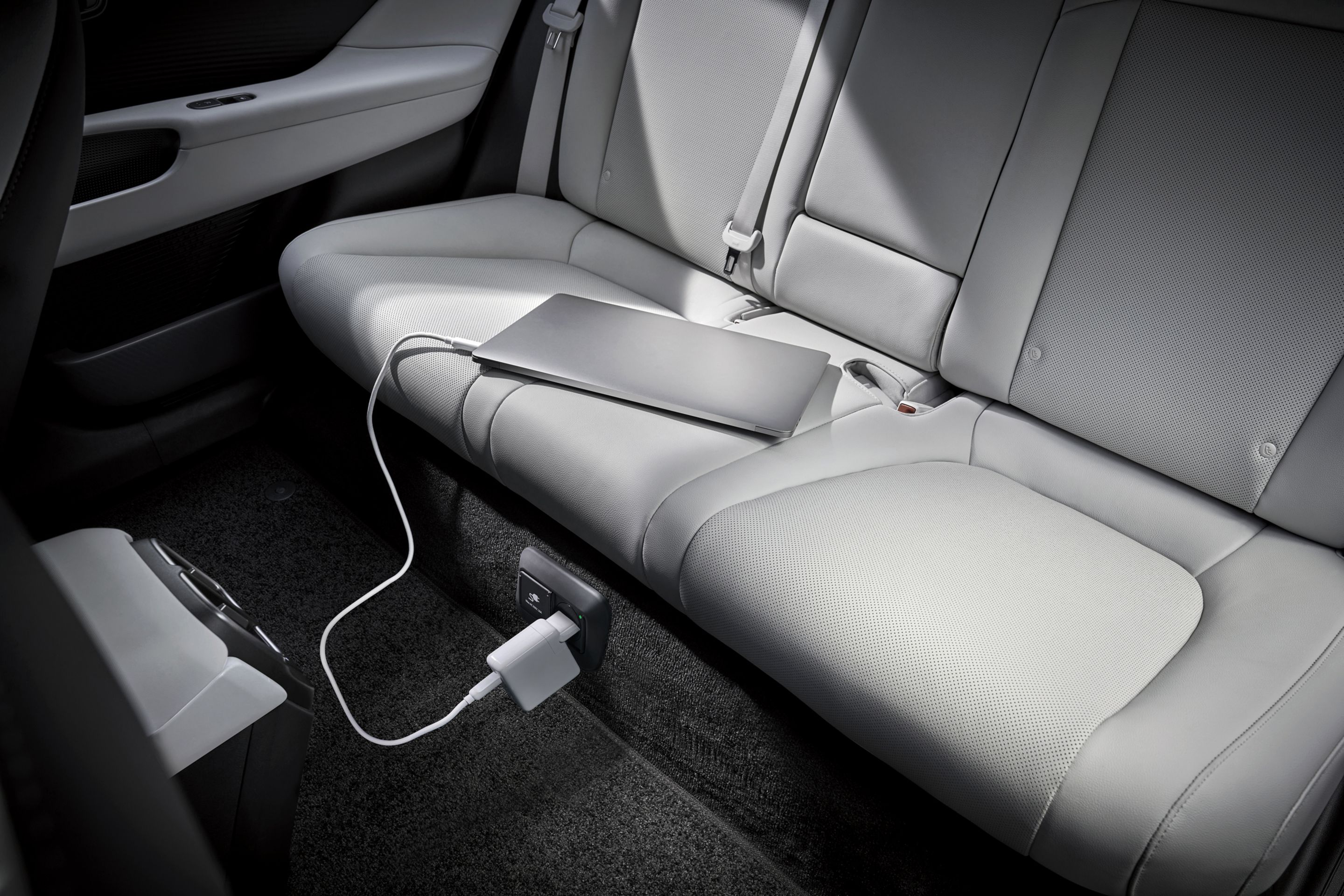 &nbsp;Laptop plugged into the on-board 230V socket of Hyundai IONIQ 6’s Vehicle-to-Load technology.