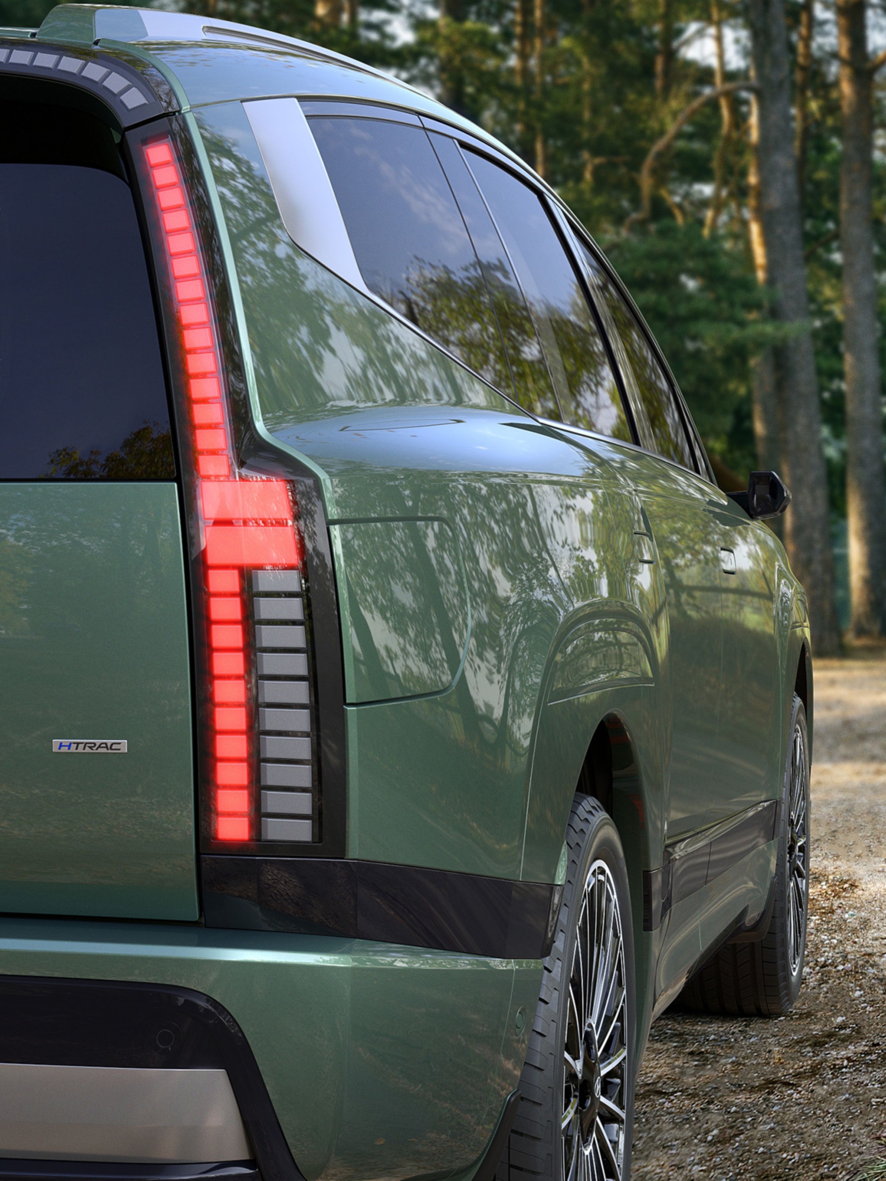 Hyundai IONIQ 9 parked near a lakeside path with a close view of the rear design.