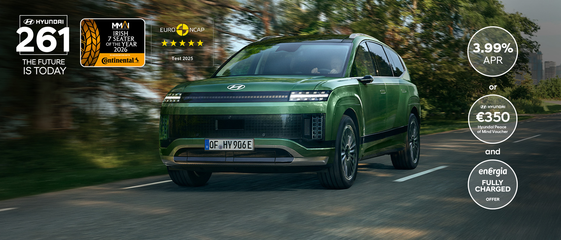 Side view of the Hyundai IONIQ 9 electric SUV with kids running around it in front of a house.	