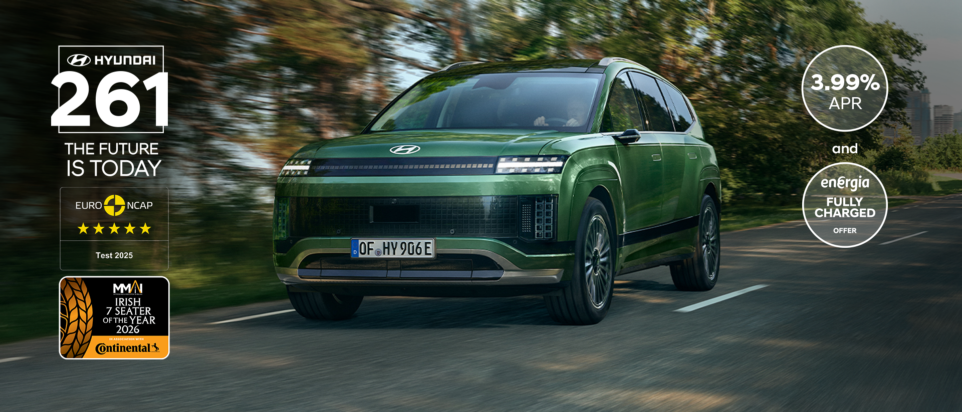 Side view of the Hyundai IONIQ 9 electric SUV with kids running around it in front of a house.	