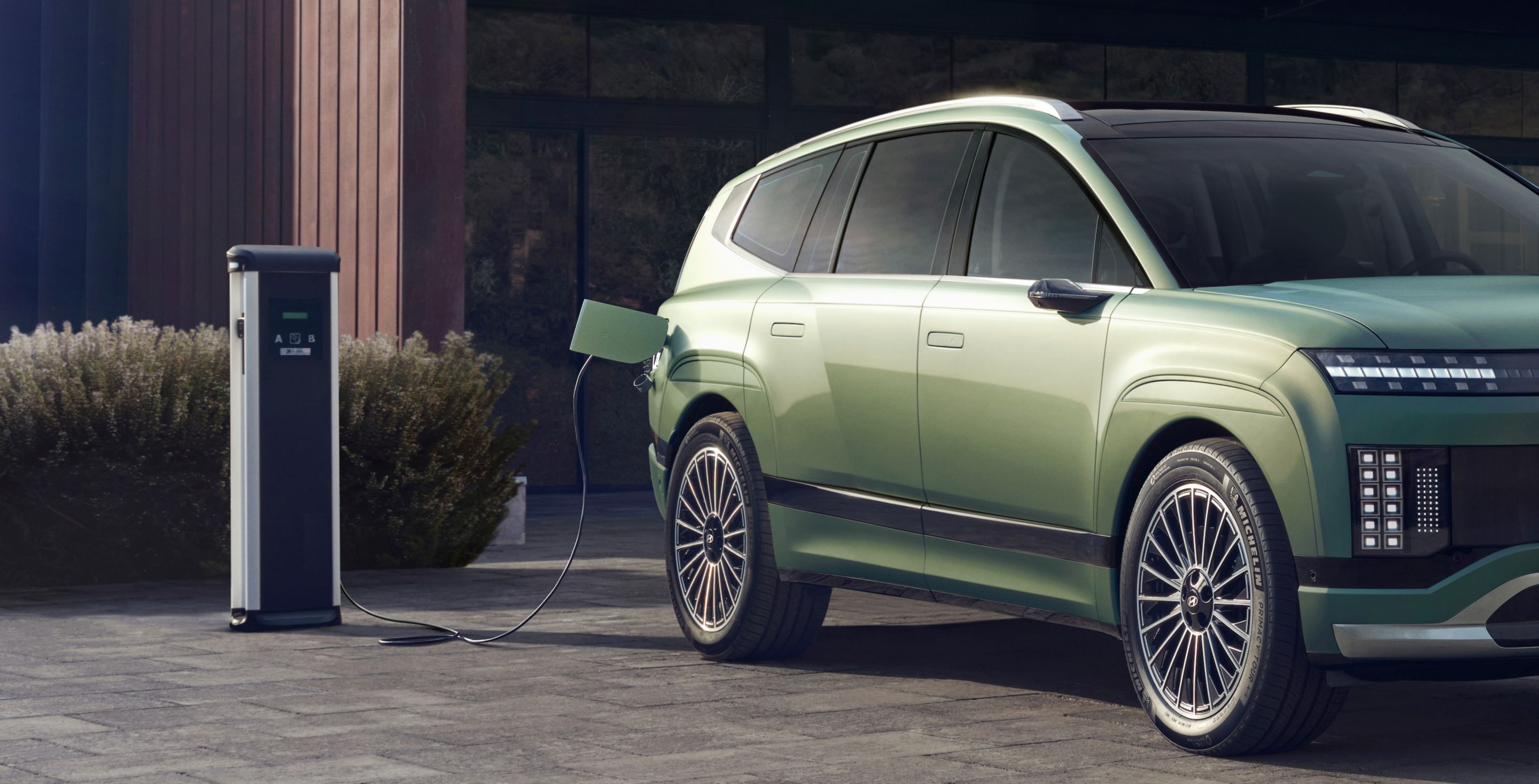 Hyundai IONIQ 9 electric SUV plugged in to charge.