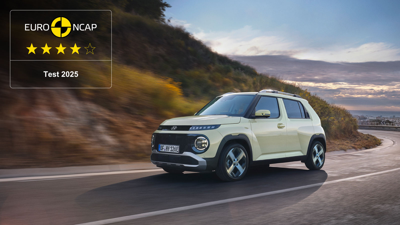 Hyundai INSTER on a scenic road with Euro NCAP rating overlay.