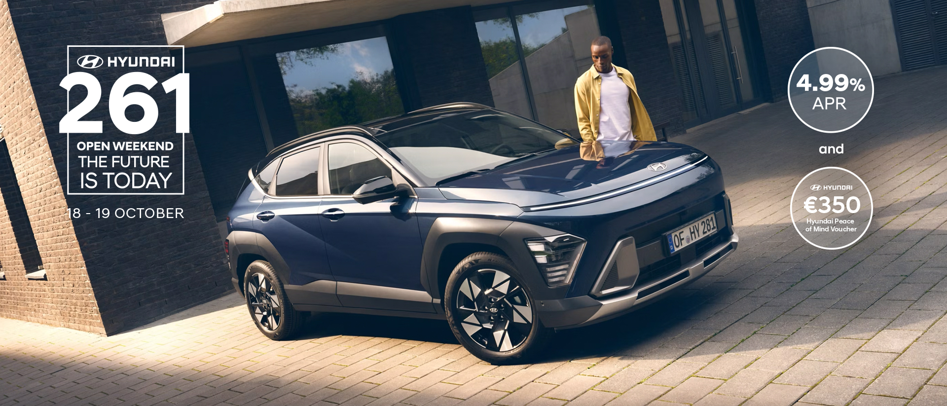 The all-new Hyundai KONA in blue parked next to a men with yellow shirt.