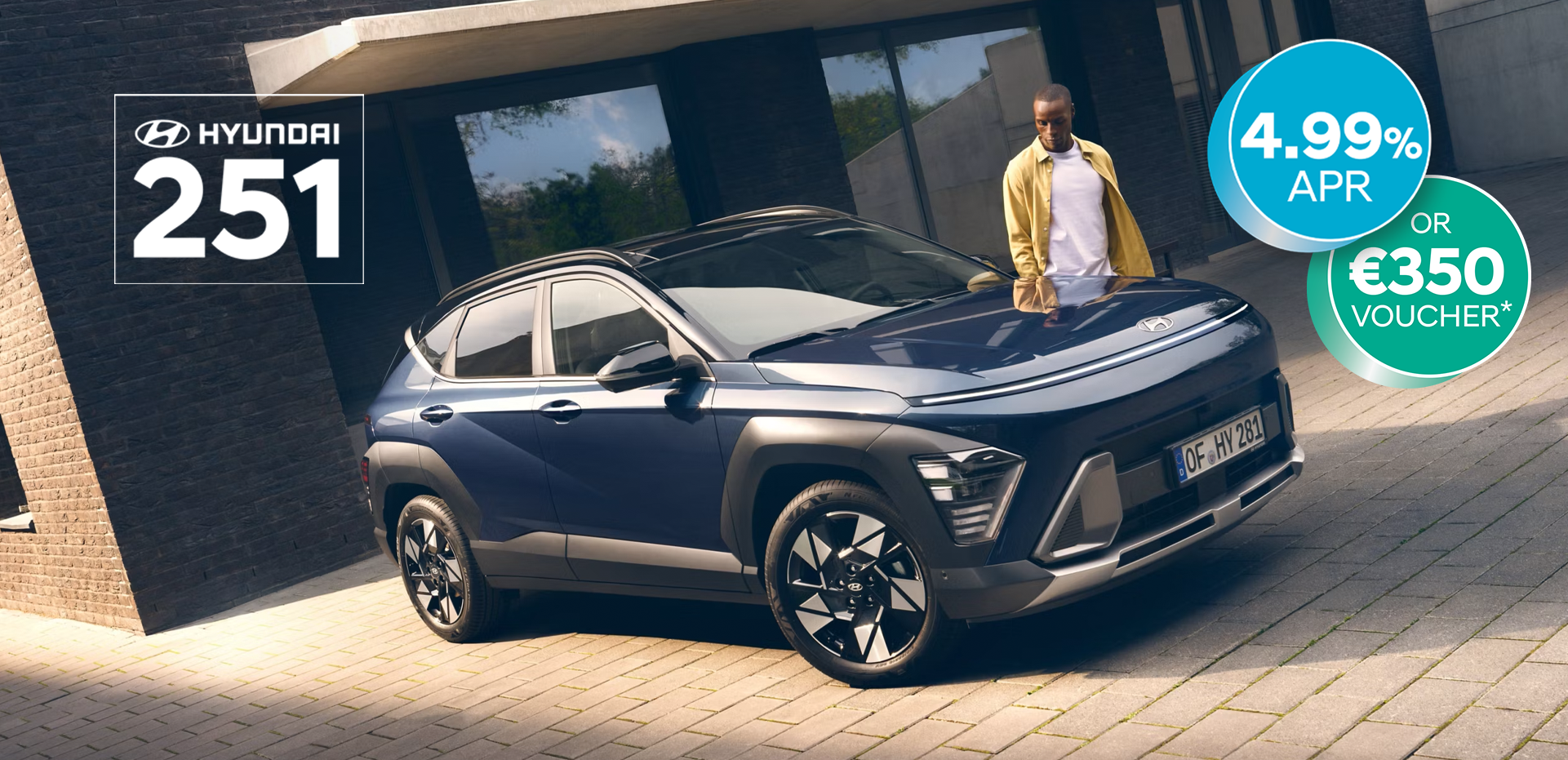 The all-new Hyundai KONA in blue parked next to a men with yellow shirt.