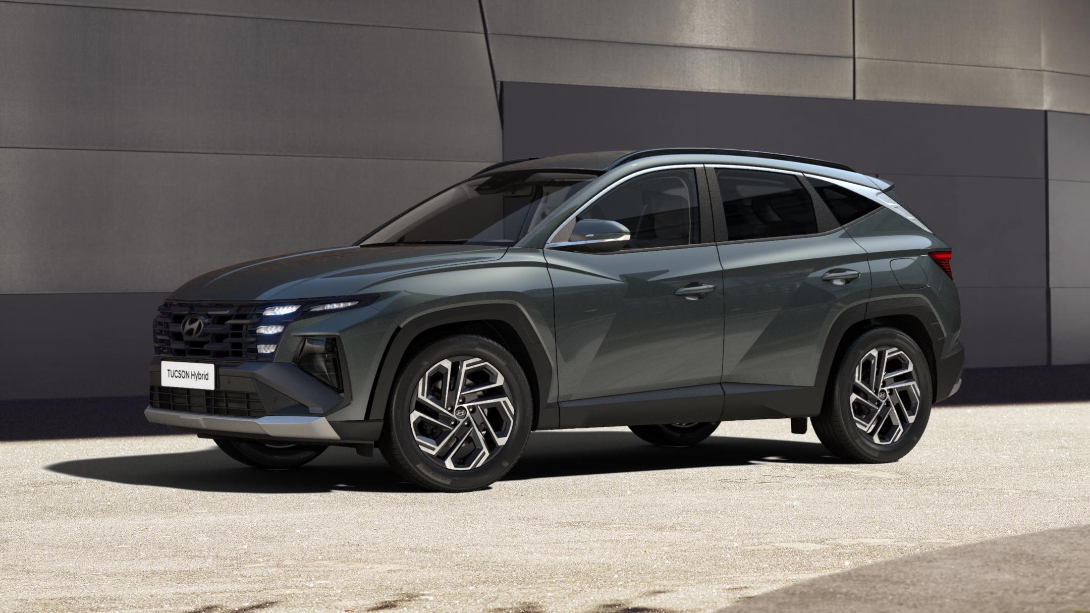 The Hyundai TUCSON Hybrid parked next to a building. 