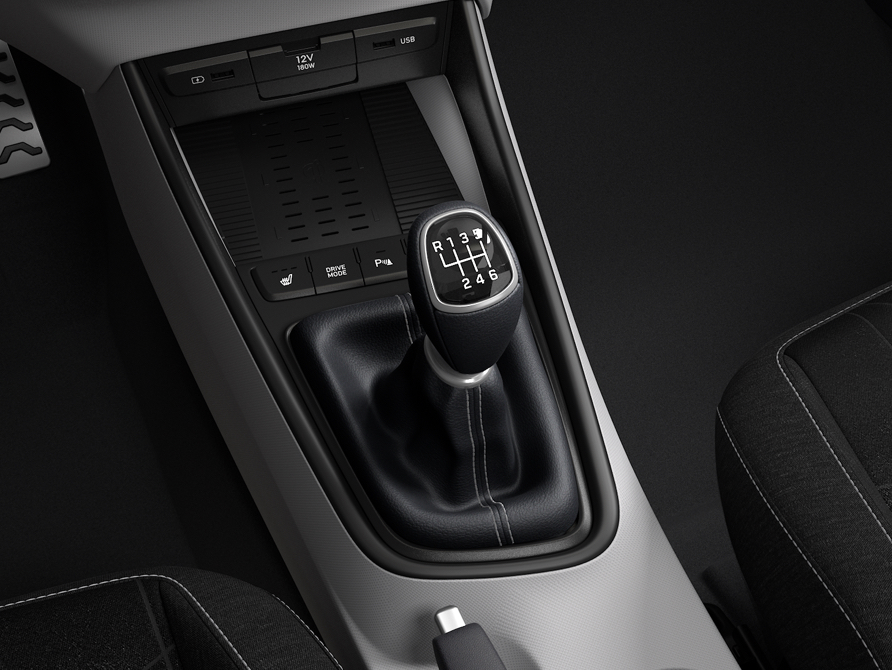 A manual transmission gear lever inside the Hyundai BAYON compact crossover SUV.