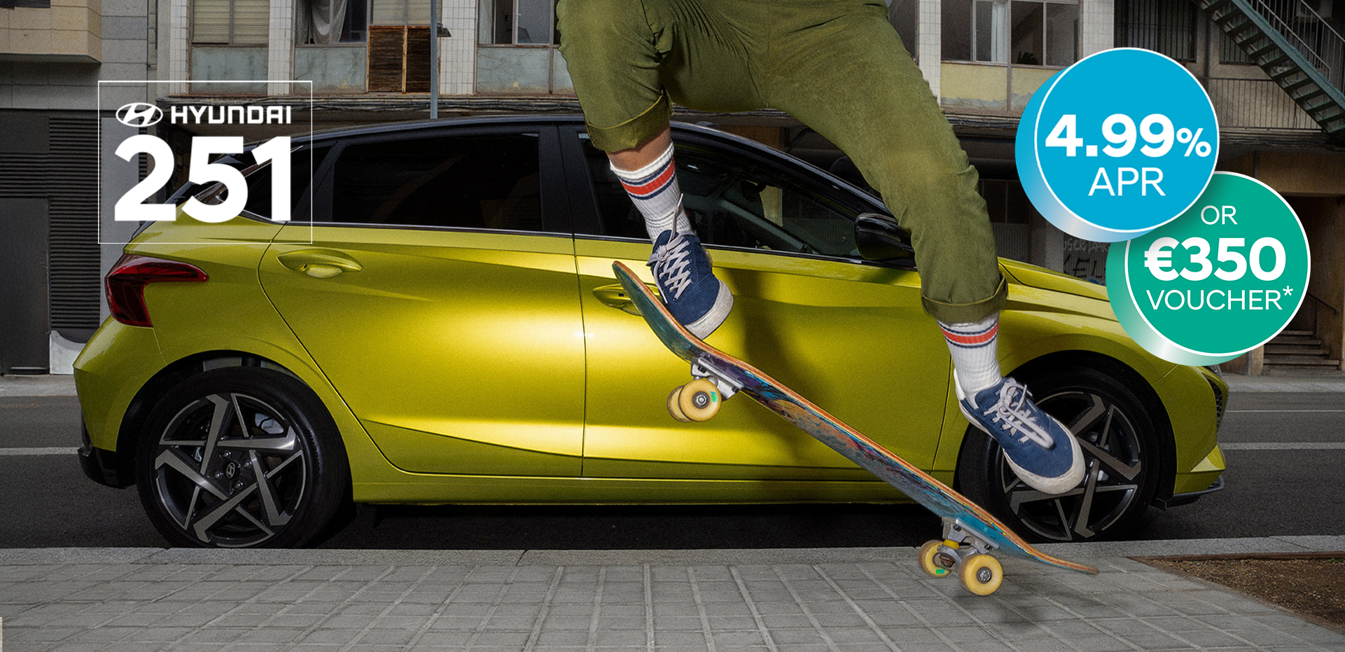 A young woman skateboarding in the street with a Hyundai i20 in the background.	