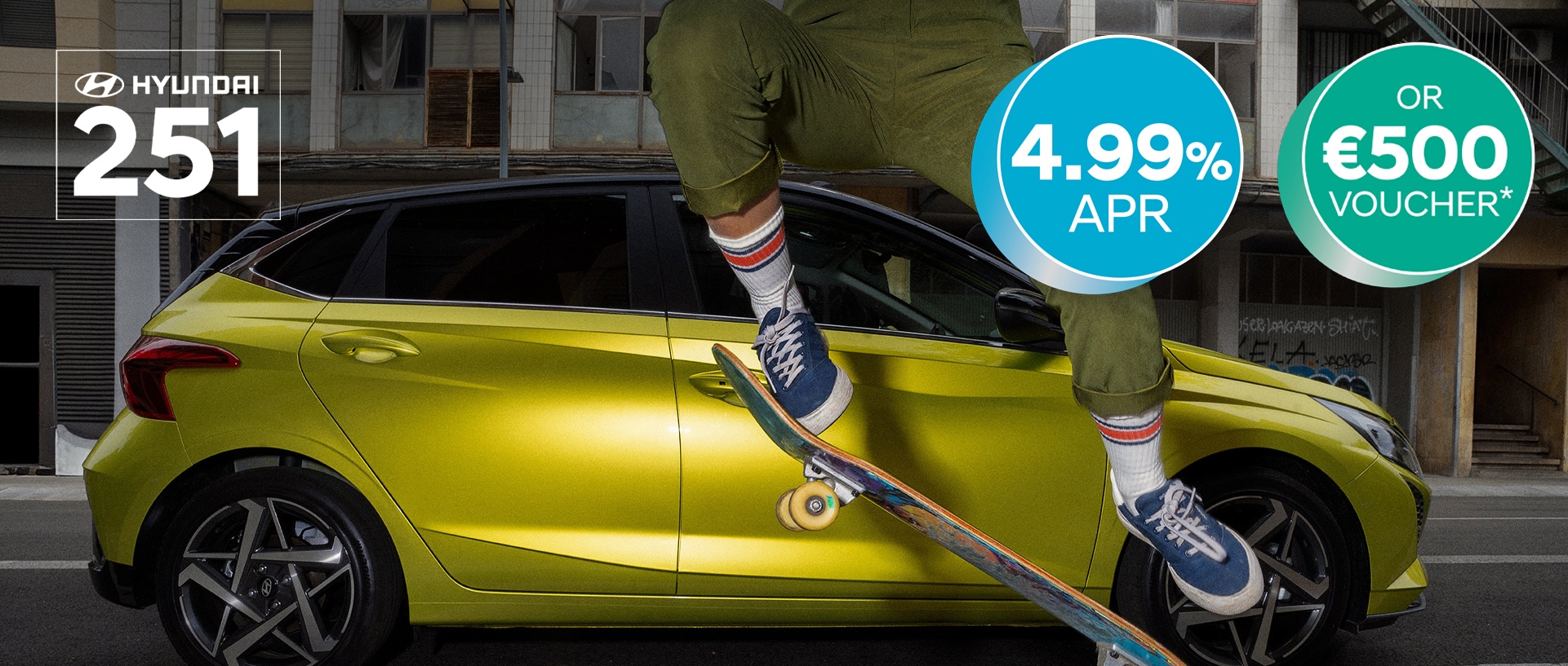 A young woman skateboarding in the street with a Hyundai i20 in the background.	