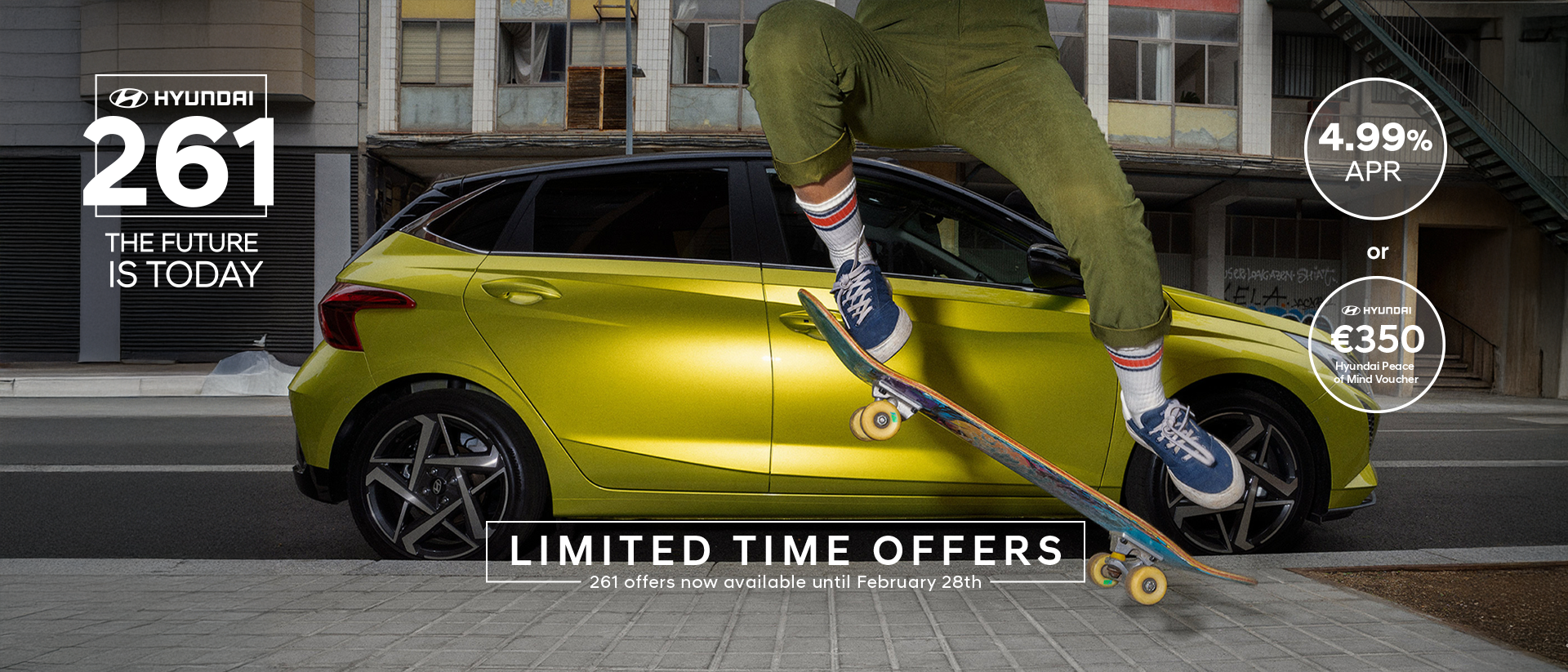 A young woman skateboarding in the street with a Hyundai i20 in the background.	