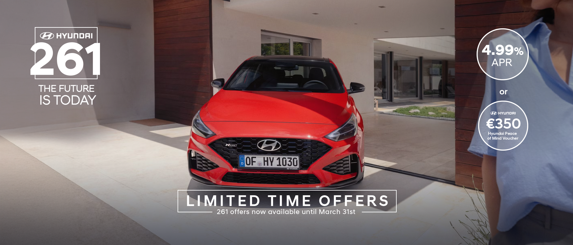 The new Hyundai i30 N Line in red parked in front of the house.