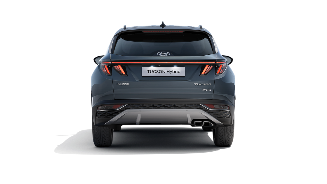 The All-New Hyundai Tucson Hybrid compact SUV pictured from the rear with its wide LED tail lamps.